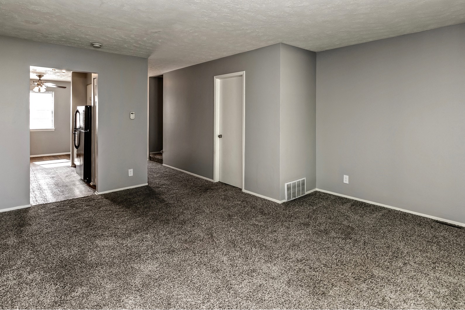 Large carpeted living room at Terrace Garden Townhomes